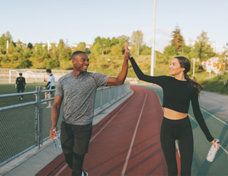 Man And Woman High Fiving