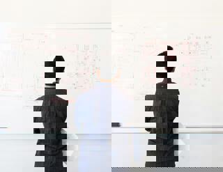 Man Looking At White Board