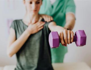 Woman Lifting Dumbell
